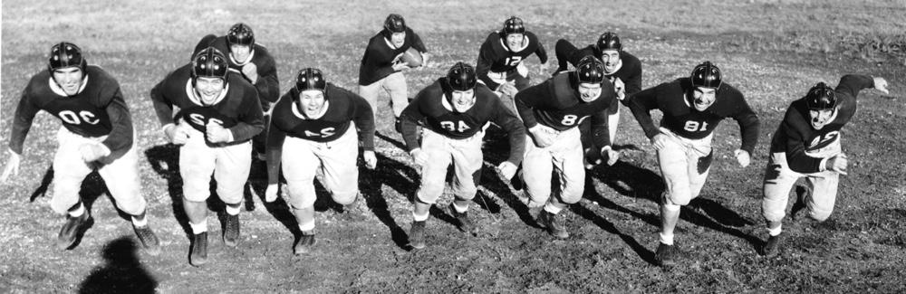 A group photo of the TCU football team in uniform in 1938