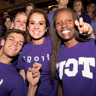 Three diverse students showing the frog hand sign