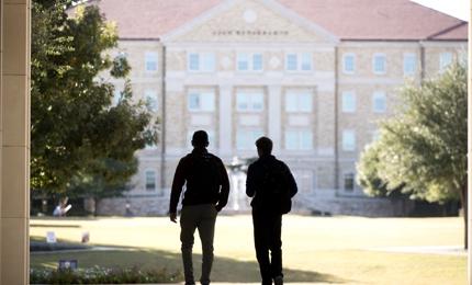 Two male students walking to class
