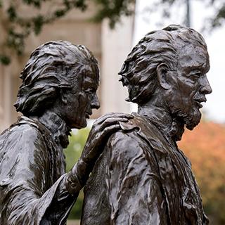 A bronze statue of TCU founders Addison and Randolph Clark