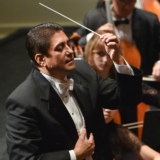 German Gutierrez conducting an orchestra